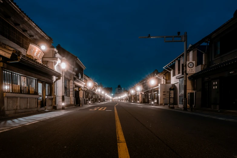 the empty street is lit up at night