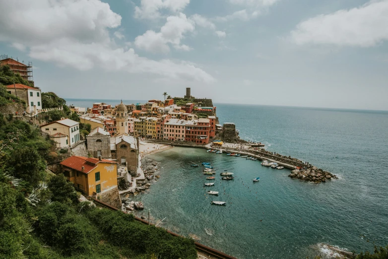 a very pretty village on top of a mountain overlooking the water