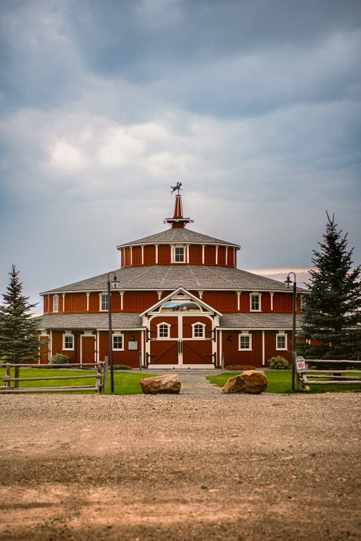 a horse standing next to a red and white building