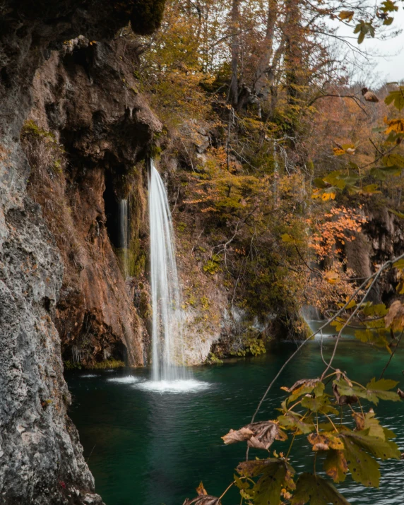 an image of a waterfall in the fall