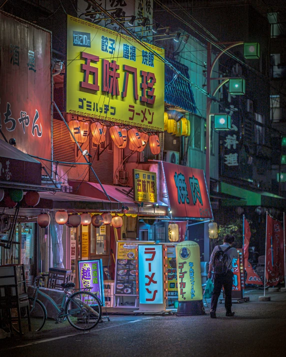 this asian restaurant has neon signs lit up in the night