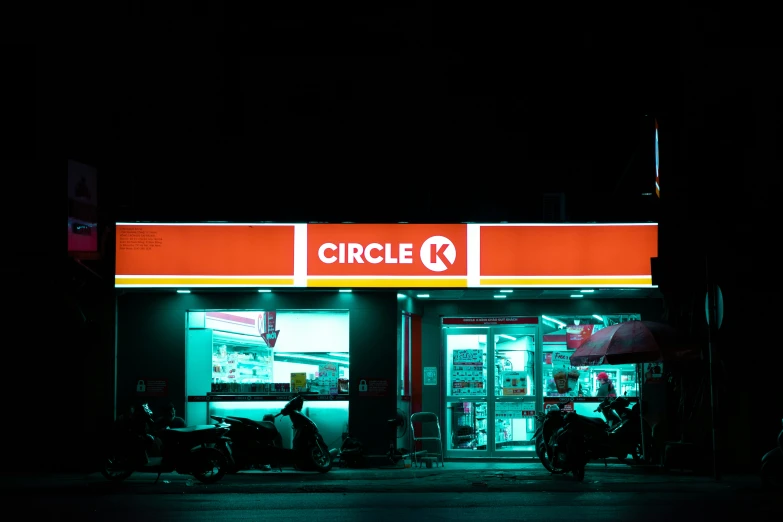 people are standing outside a circle k convenience store