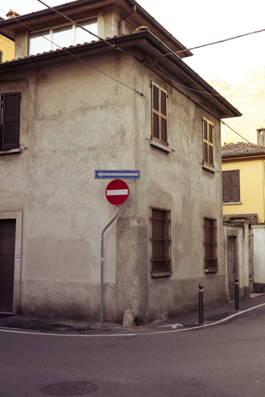 there is a stop sign on the corner of the street