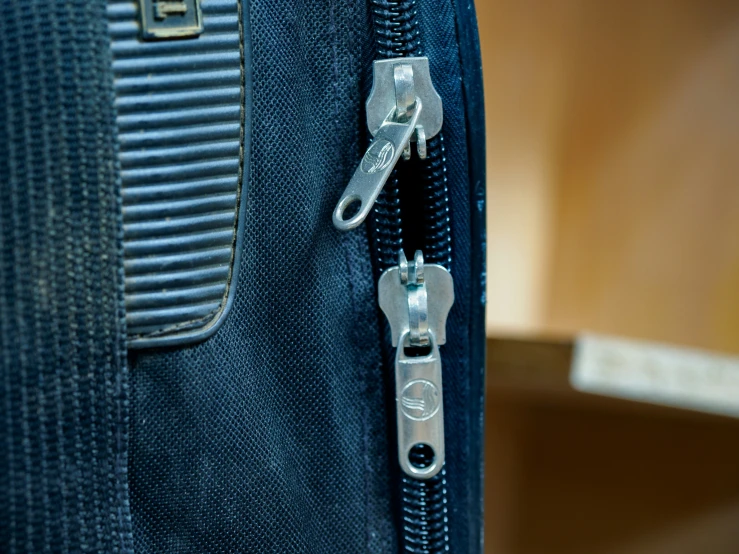 a piece of luggage with silver metal handles