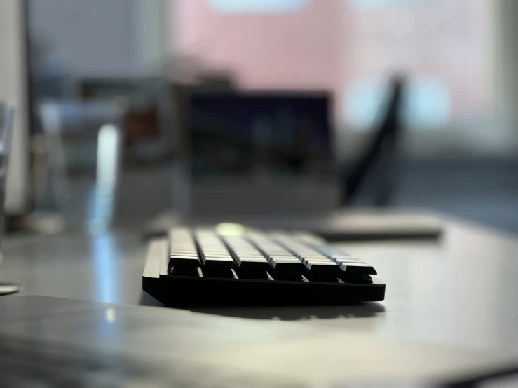 a small keyboard is sitting on a desk