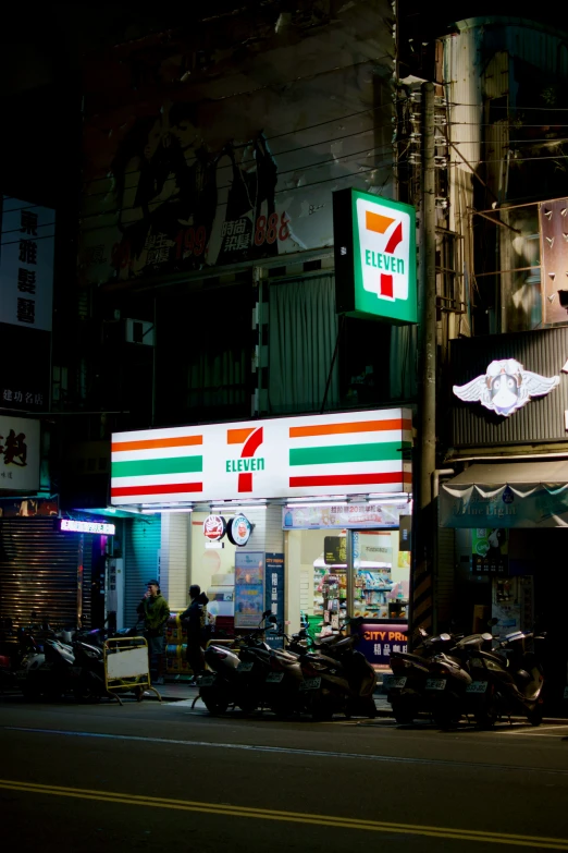 the storefront of an establishment is lit up at night