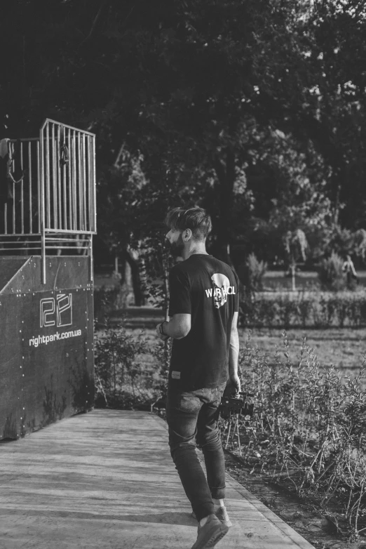 a man riding a skateboard down a sidewalk