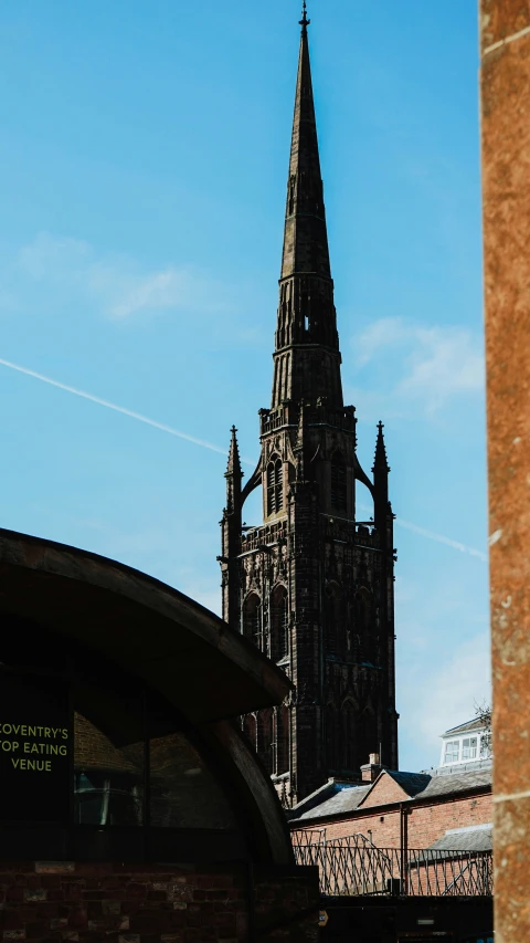 the tall church steeple is towering high in the sky