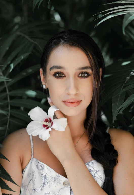 an image of a young woman wearing a white dress