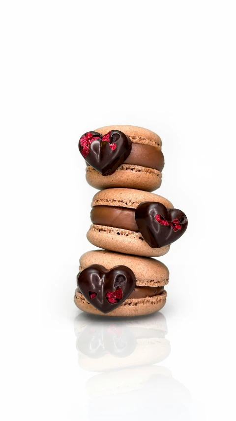 chocolate covered sandwiches arranged in the shape of hearts