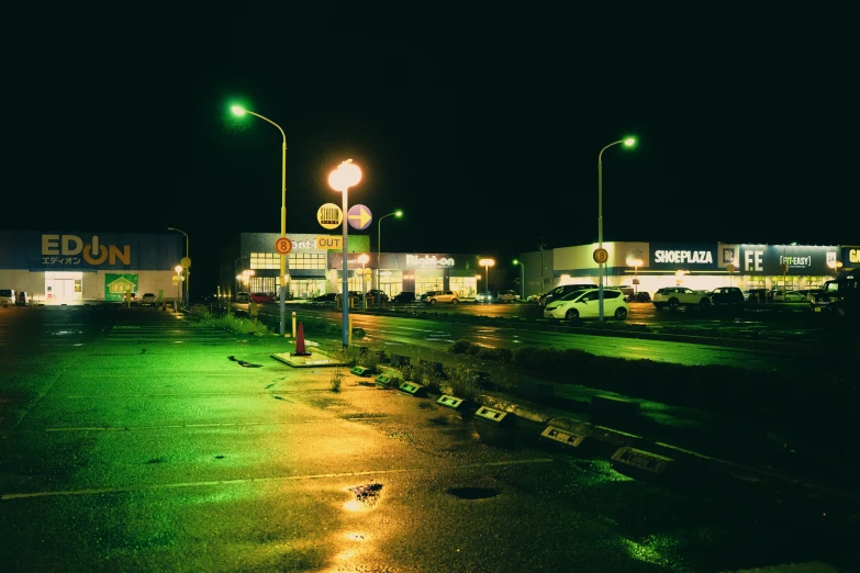 a car sits parked in a dark lot at night