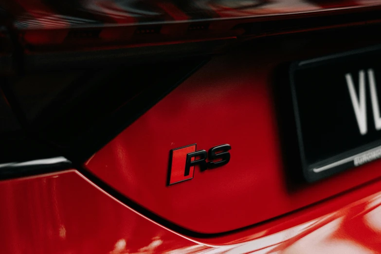 the hood and engine badges on a sports car