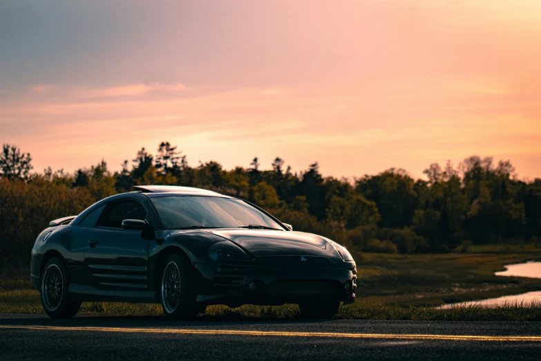 a black sports car parked on the side of the road