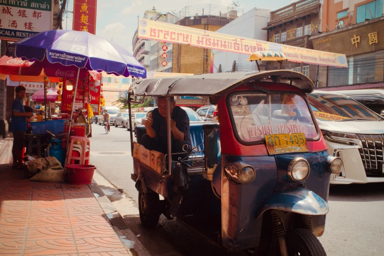 a small truck is parked on the street