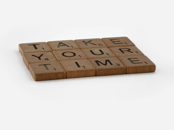 an up - cycle word tile with words written in it