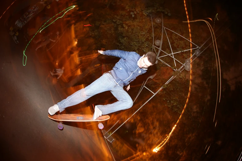 an aerial view of a skateboarder doing a trick