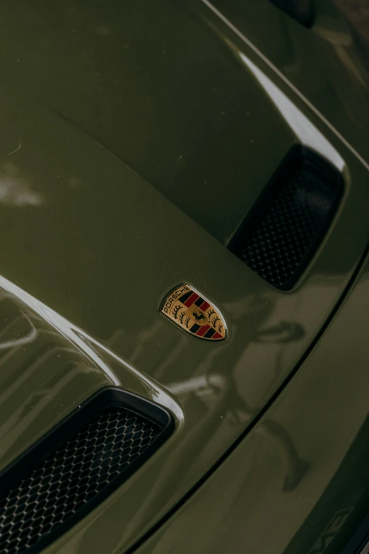 the emblem on this green car is shown