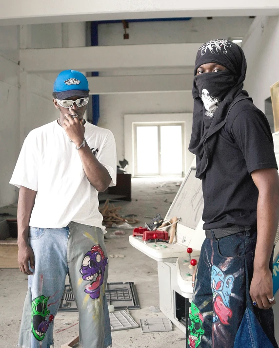 a man wearing a mask while talking on a phone