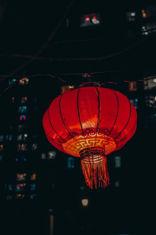 red lanterns are lit with lights in the dark