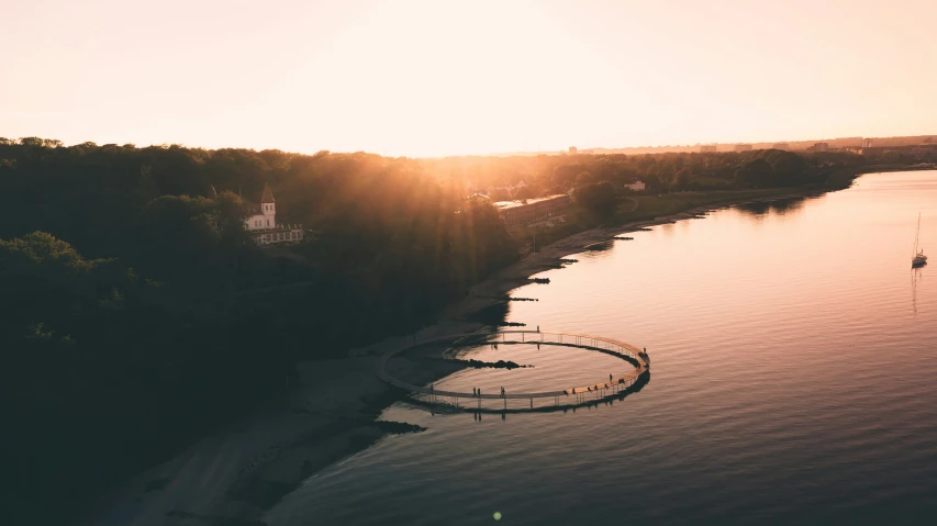 a dock is situated between the lake and trees