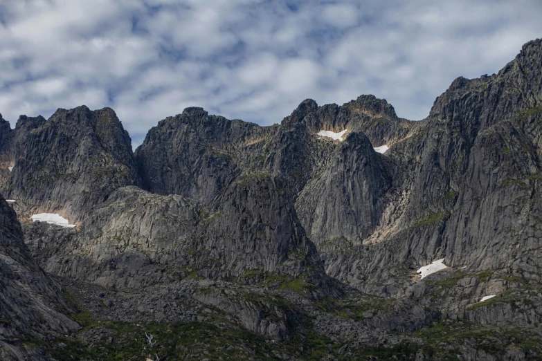 the mountains are very tall with snow on them