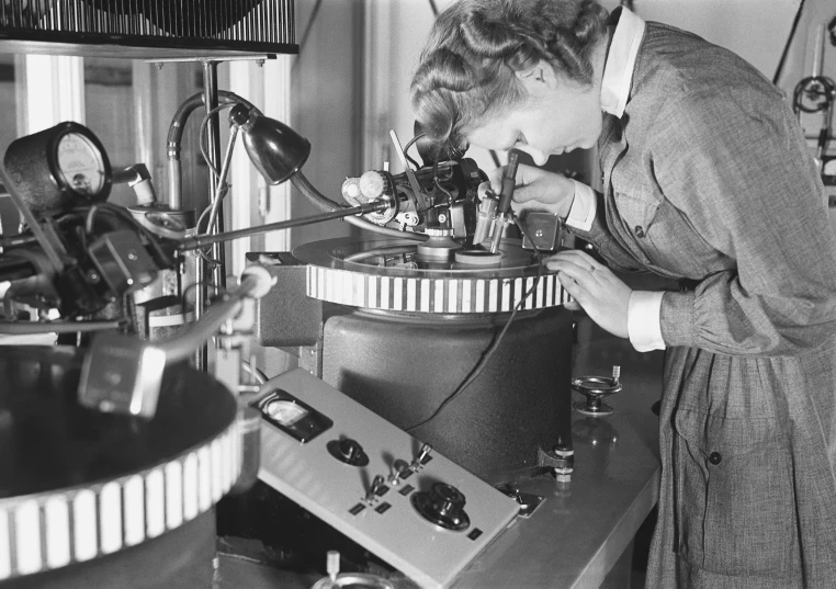 two women looking at electronics in an old time shop