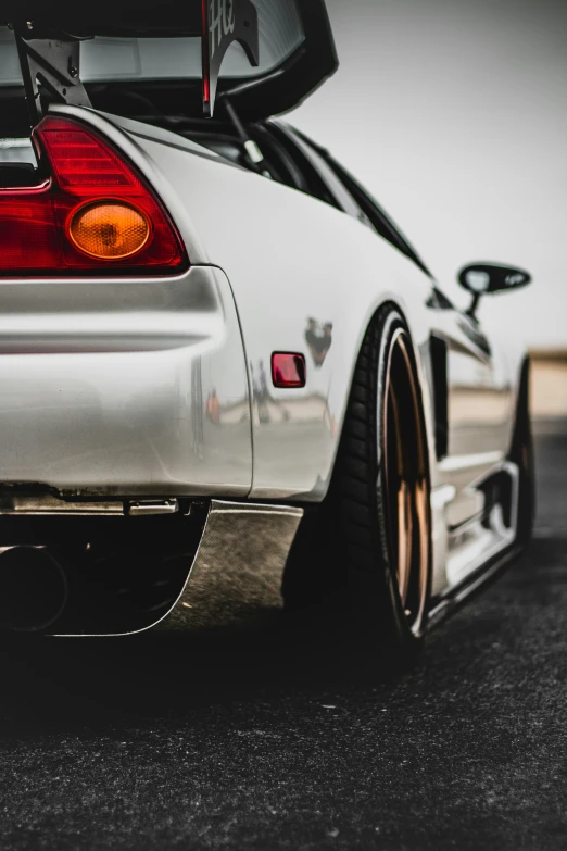 a white car is parked on a street