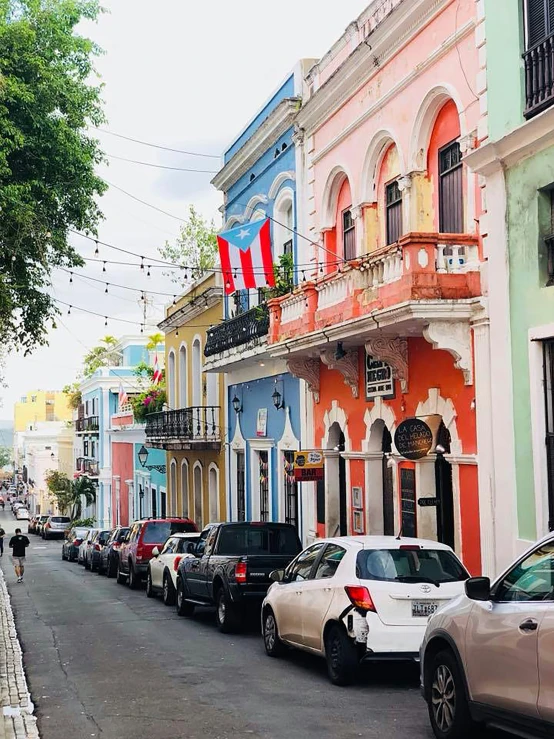 a street full of colorful buildings and cars