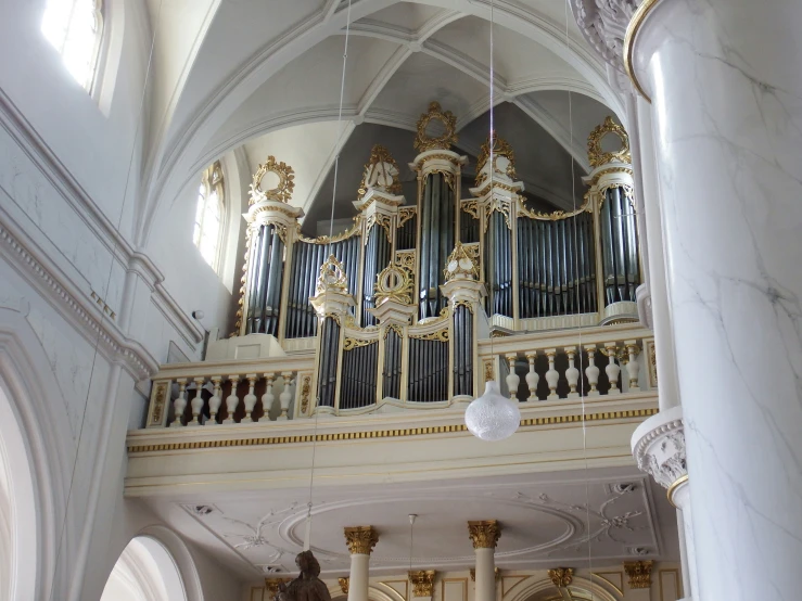 large organ in a very ornate white building