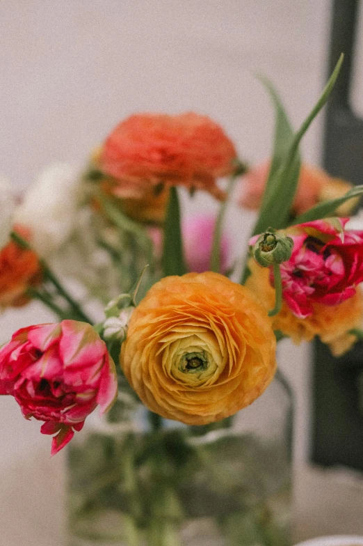 flowers arranged in a vase in a room