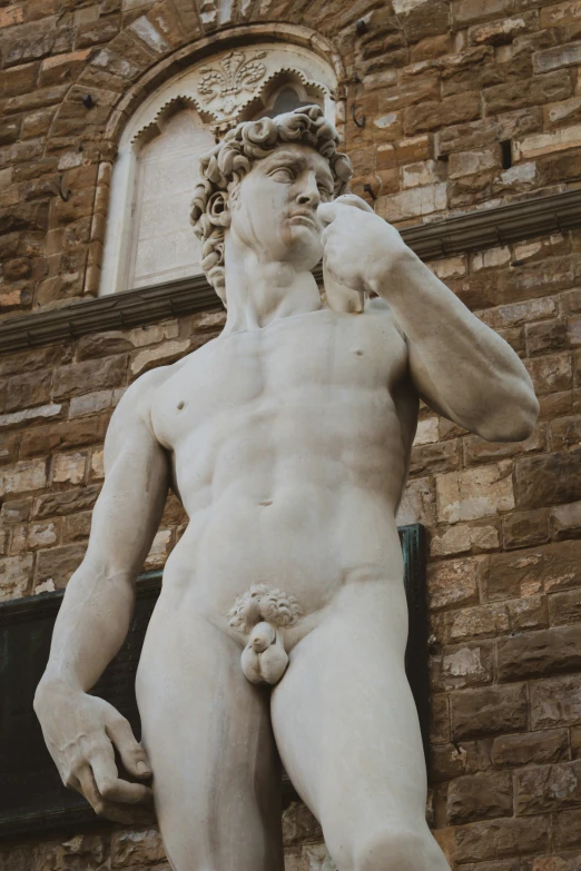 the statue of a man in front of a building