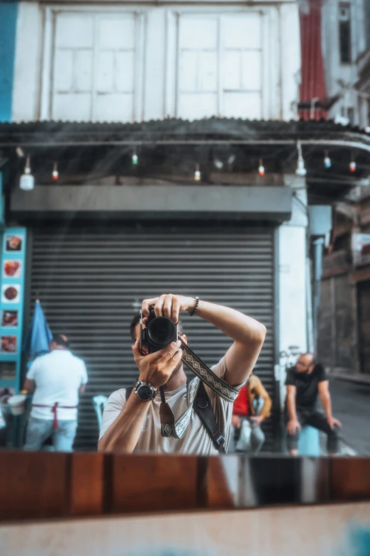 a man with a camera taking a picture