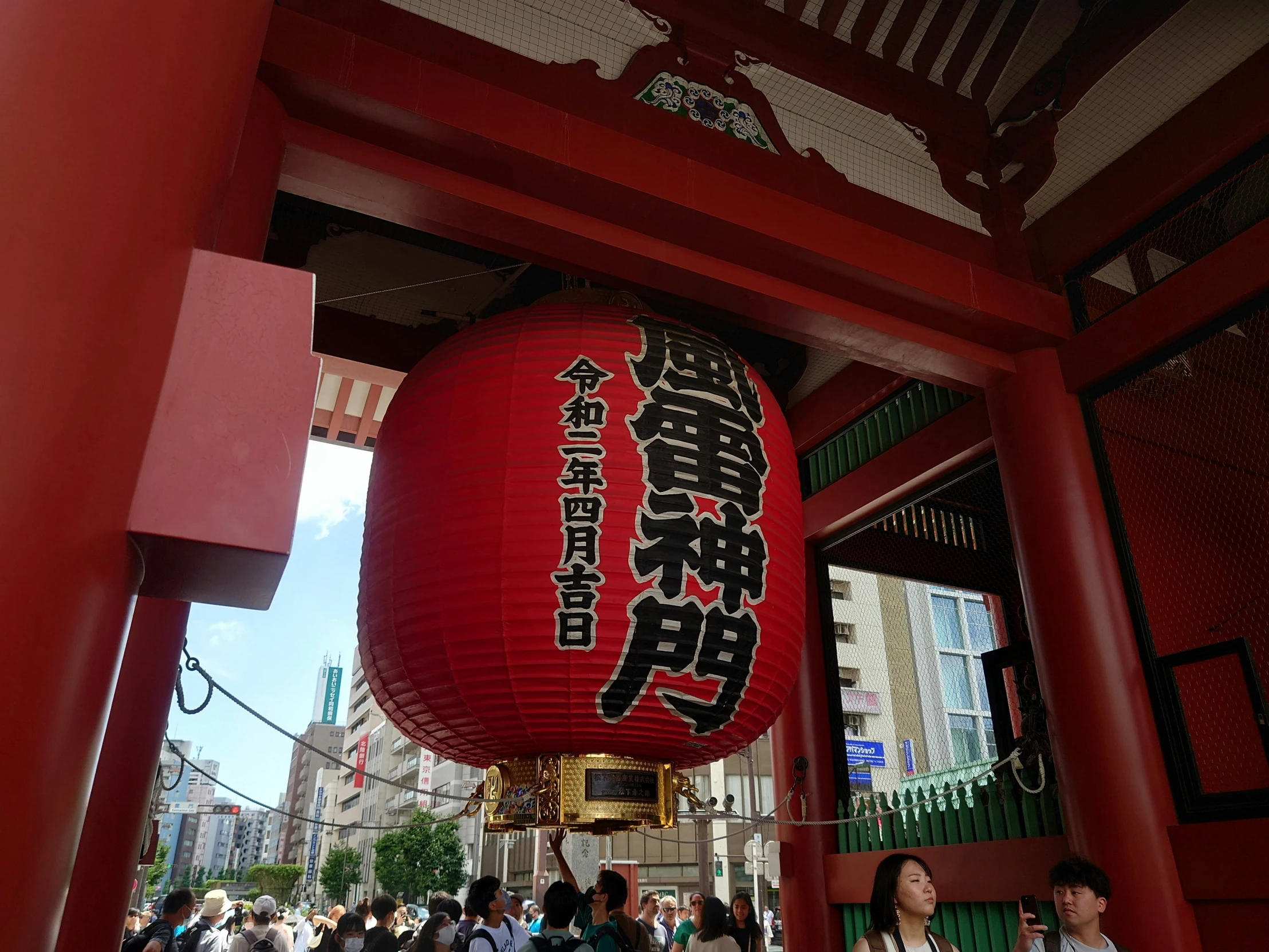 people are walking in front of an oriental building