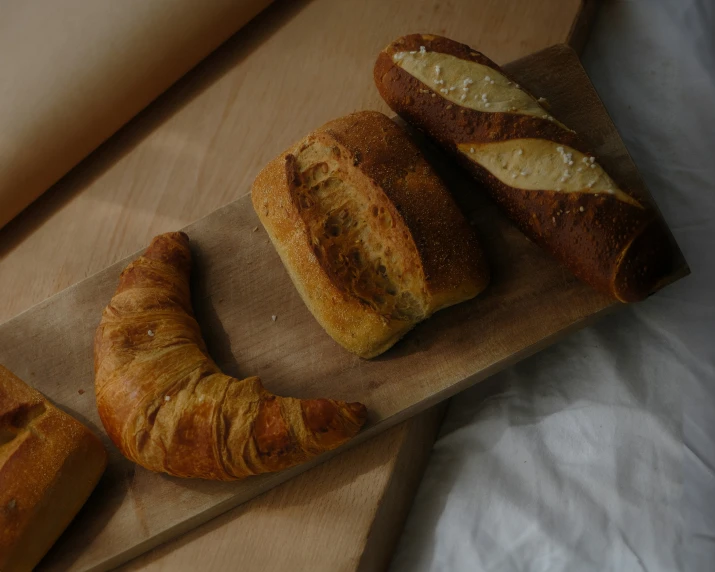 a brown table holding bread that has been sliced into slices