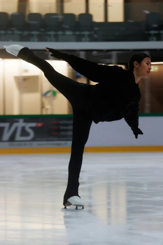 a man doing skate tricks on a rink