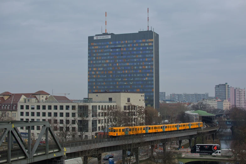 the train is passing on the bridge over the river