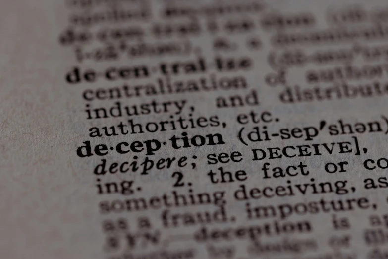 a close up of the words describing deep deception in a book