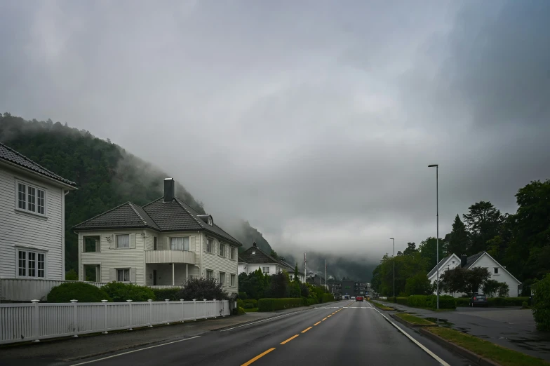 there are white buildings and clouds in the sky