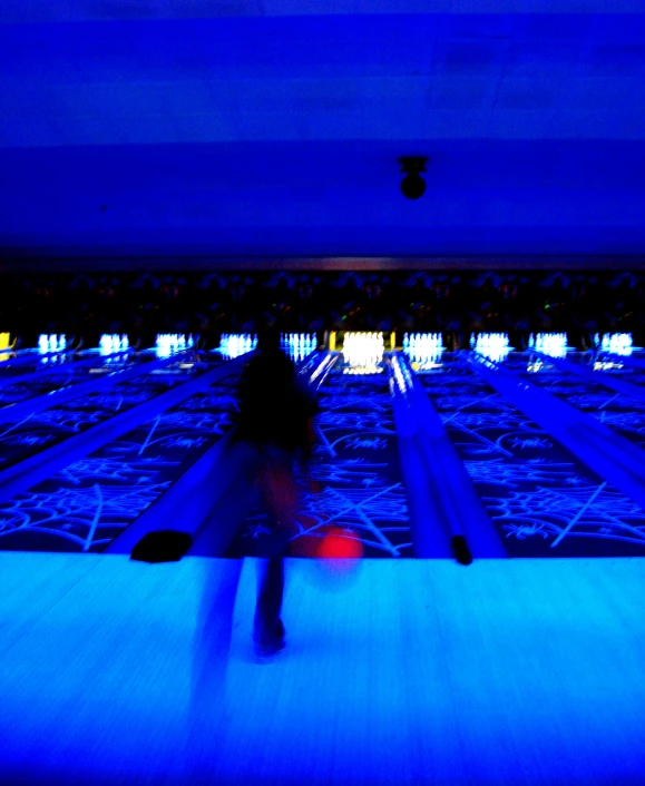 the silhouette of a person hing along on a roller blade