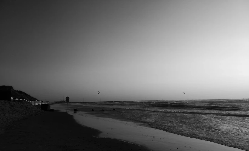 a couple of people are walking the shoreline