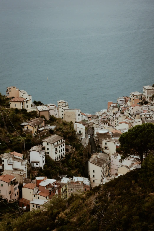 a view of a town sitting on the top of a hill