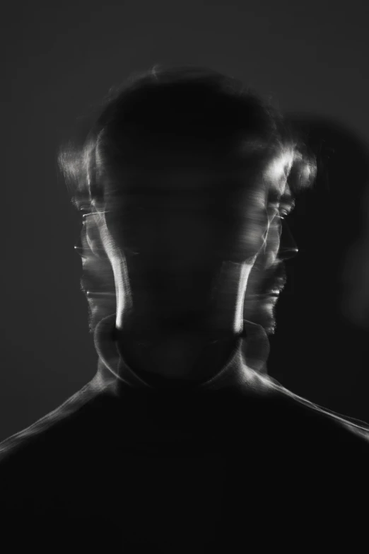 blurry pograph of a man's face in black and white