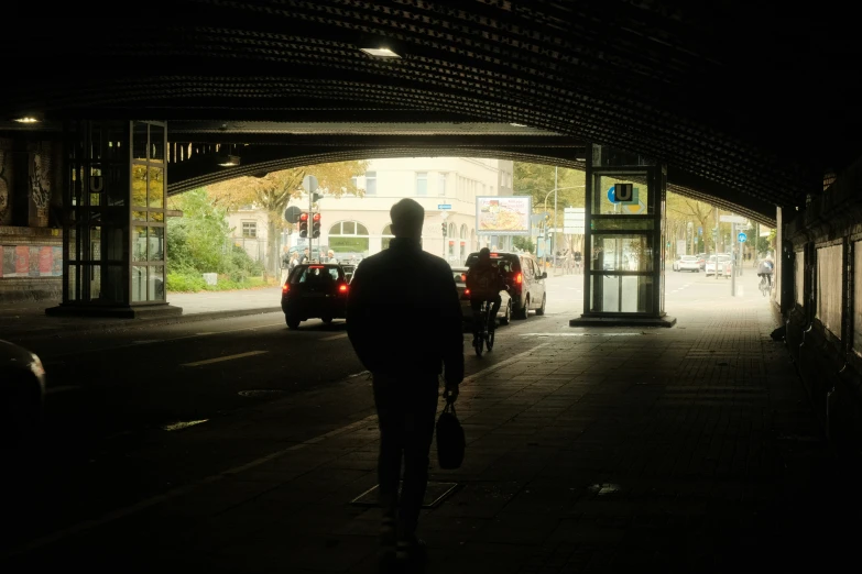 a man riding a skateboard into a bus stop