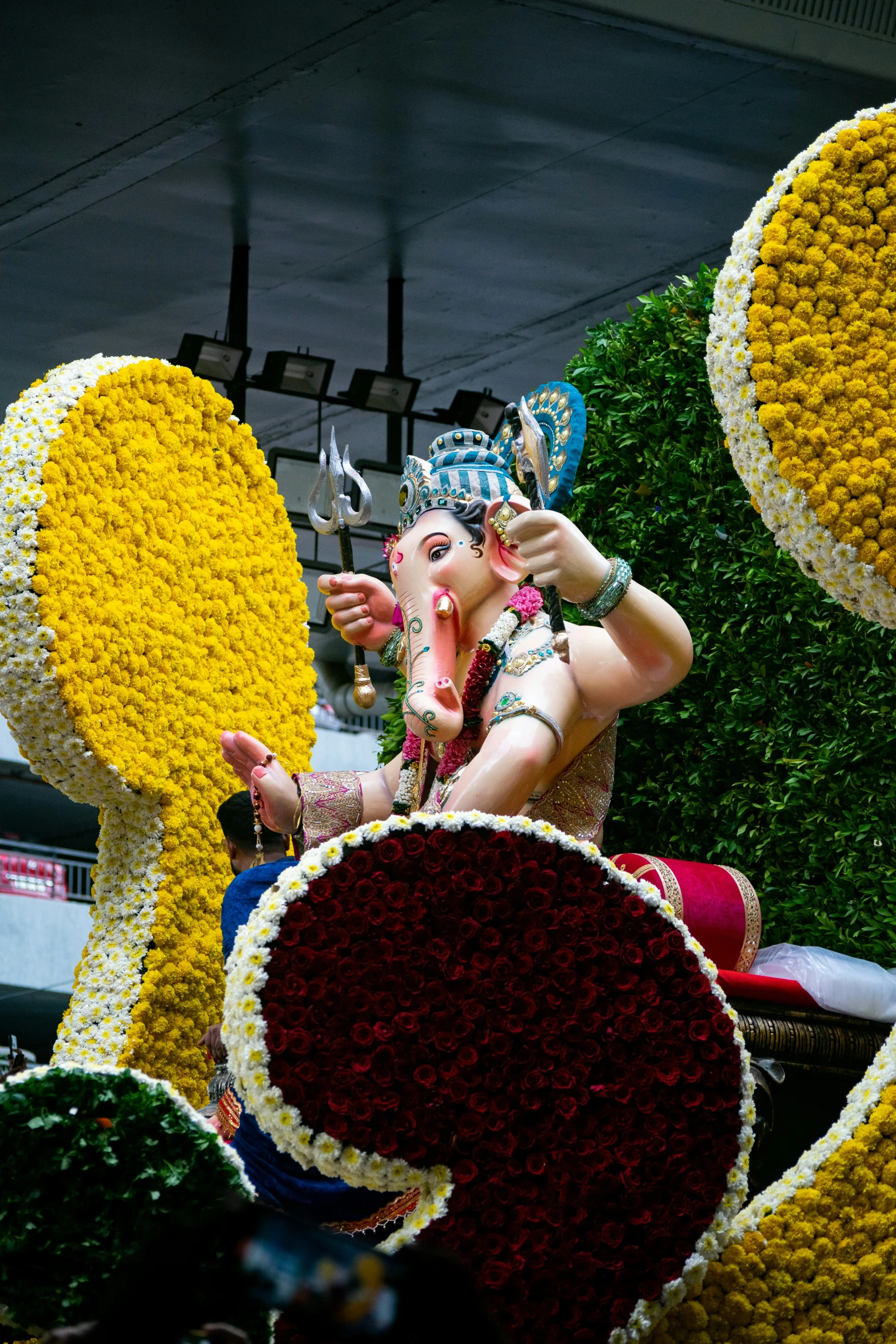 a person standing on a float in the middle of a parade