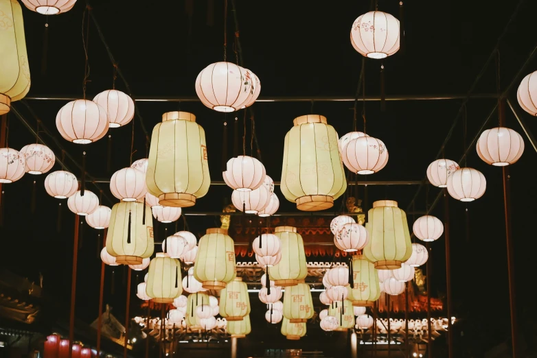 lots of round lanterns are hung in the air