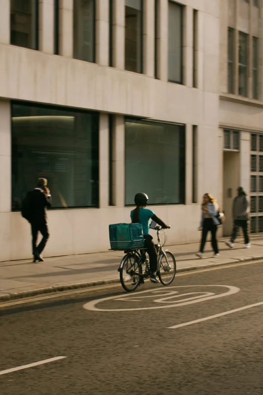 a man is riding a bike with luggage on his back