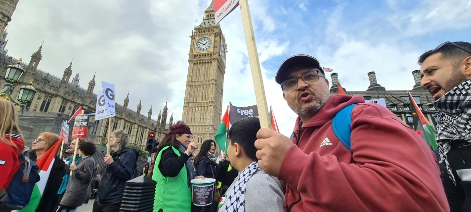 two men stand by the big ben clock tower