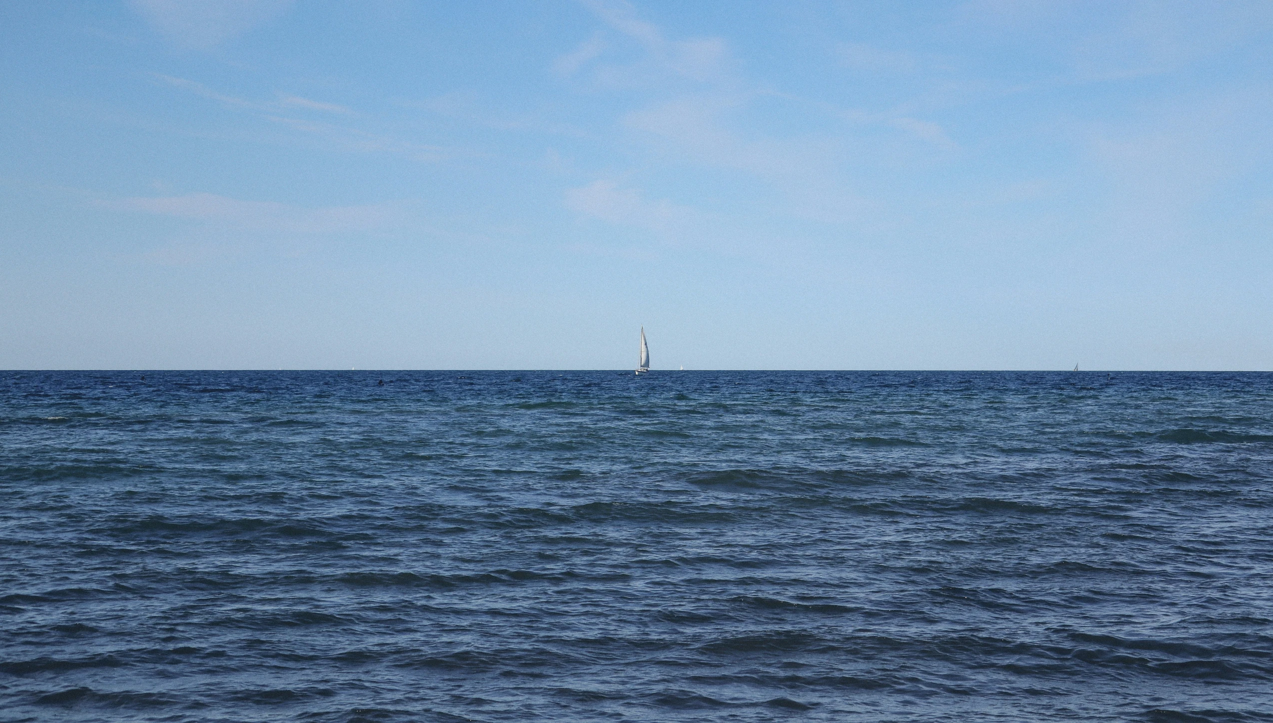 an image of the ocean that looks calm