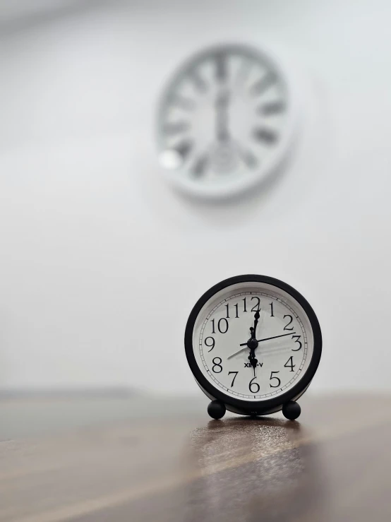 a clock sits on the table before it is raining