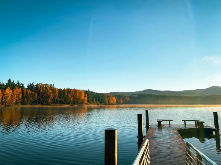 a dock that is sitting in the middle of a body of water